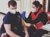 Part of the East Shore District COVID-19 vaccine program, East Haven firefighters get vaccinated at Branford High School.