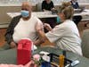 Getting the second vaccine dose, John Ormond, now a resident, contracted COVID-19 while working at Whispering Pines Nursing & Rehabilitation Center