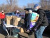 During CT Shoreline Indivisible's National Day of Service Monday, in honor of Martin Luther King Day, a regional drive food, diaper and sanitary supply drive, donors dropped off supplies in the Guilford commuter parking lot Monday.