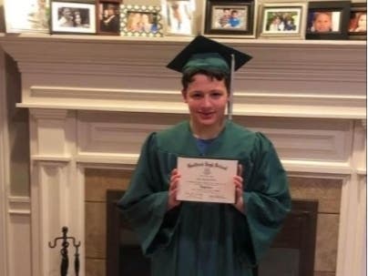 Ellis Tibere officially graduated from Guilford High School while out on bail for allegedly stabbing a Greenwich woman in a random and violent attack in Westport, his family says, while in a psychotic episode as a result of his mental illness. 