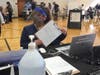 Checking in at the Fair Haven Community Health mass COVID-19 vaccine clinic in New Haven.