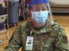 A CT National Guard member assists people at the Fair Haven Community Health mass COVID-19 vaccine clinic in New Haven Wednesday.