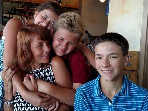 Jody Catalano, 52, a Madison mother of three, pictured with her children, was killed when in a snowmobiling accident in Vermont. Madison is rallying around the family. 