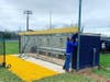 Public works employees have been sprucing up the town. Here a worker is replacing the East Haven High School field dugout.