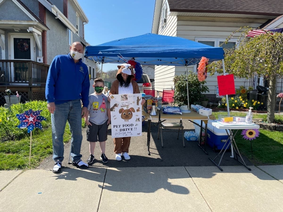 Mayor Joe Carfora makes a donation and thanks Connor.