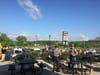 Connecticut State Police troopers at the Branford I-95 service plaza in foreground with striking workers in the background. 