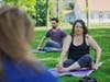 Anna Demeter and Ben Shanbrom practicing yoga. 