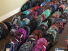 A small sea of backpacks destined for kids in need. 
