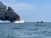 Branford Fire Department fire boats are seen battling a fire aboard a large yacht on LI Sound right off the Branford coastline.