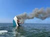 The 70-foot yacht had a fire that was "too well involved" making de-watering dangerous. It sank around 3 p.m. 