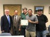 Jonathan Padilla, on the job as a Guilford maintenance custodian, was praised for his work ethic, kindness, and willingness to always lend a helping hand. Town staff and Padilla with the Employee Recognition award. 