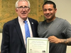 Jonathan Padilla, on the job as a Guilford maintenance custodian, was praised for his work ethic, kindness, and willingness to always lend a helping hand. First Selectman Matt Hoey presents Padilla with the Employee Recognition award. 