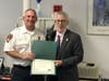 Guilford Fire Department captain James Considine was honored by First Selectman Matt Hoey. 