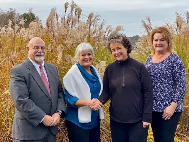 Pictured are Mina West, President of Branford Microfund and BMF Volunteer Bob Imperato; Laura Noe, HFS Leader and Coordinator, and Michelle Hoffman, Branford Branch Manager of Crosspoint Federal Credit Union.
 