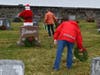 Volunteers laying wreaths.