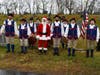 Santa poses with members of Stony Creek Fife & Drum Corps