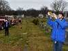 Taps being played at cemetery. 