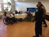Whispering Pines Nursing & Rehabilitation Center residents learn more about K9s after presenting a donation to police to put toward K9 bulletproof vests.