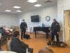 East Haven police K9s Ace and handler officer McGuire and K9 Enzo and handler officer Palma speak to residents at Whispering Pines Nursing & Rehabilitation Center.