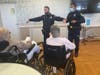 East Haven police K9 officers speak to residents at Whispering Pines Nursing & Rehabilitation Center.