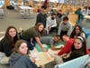 GHS Interact Club students create posters for the Diaper and Food Drive-Thru donation event Saturday.