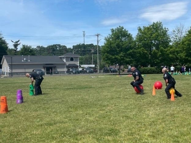Looks like North Branford police officers had a (bouncing) ball at Jerome Harrison Elementary School​'s Fun Day. 