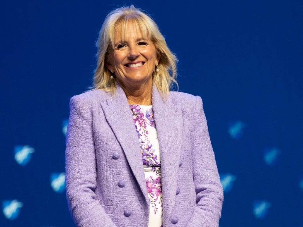 First Lady Jill Biden smiles as she is introduced before speaking during the American Federation of Teachers convention, July 15 in Boston. Jill Biden and Education Secretary Miguel Cardona are kicking off a summer learning tour this week in New Haven.