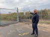 East Haven Fire Chief Matthew Marcarelli at a gated entrance on the East Haven side of the Tweed New Haven Airport
