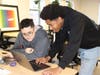 Mo Seck, associate software engineering educator, works with DAE student Diego on his website project. DAE is a Connecticut nonprofit democratizing access to 21st century digital career and life skills for underrepresented youth.