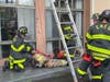 As a reporter stood by, a small group of firefighters began the first of two firefighter rescue simulations; one with a dummy and one with a real firefighter.