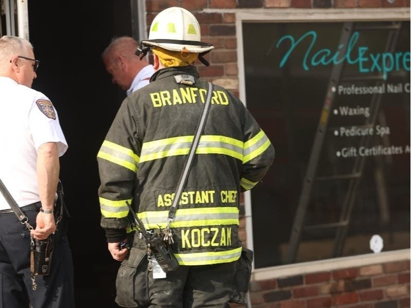 Firefighters arrived within minutes and were met with heavy smoke and then conducted a coordinated interior fire attack and located a smoldering fire within the structure: Branford Fire Department.