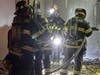 Fire crews forced entry into the bulding and "conducted an aggressive interior attack, successfully extinguishing the attic fire from below while protecting the adjoining barber shop and residential occupancies from significant damage:" BFD.