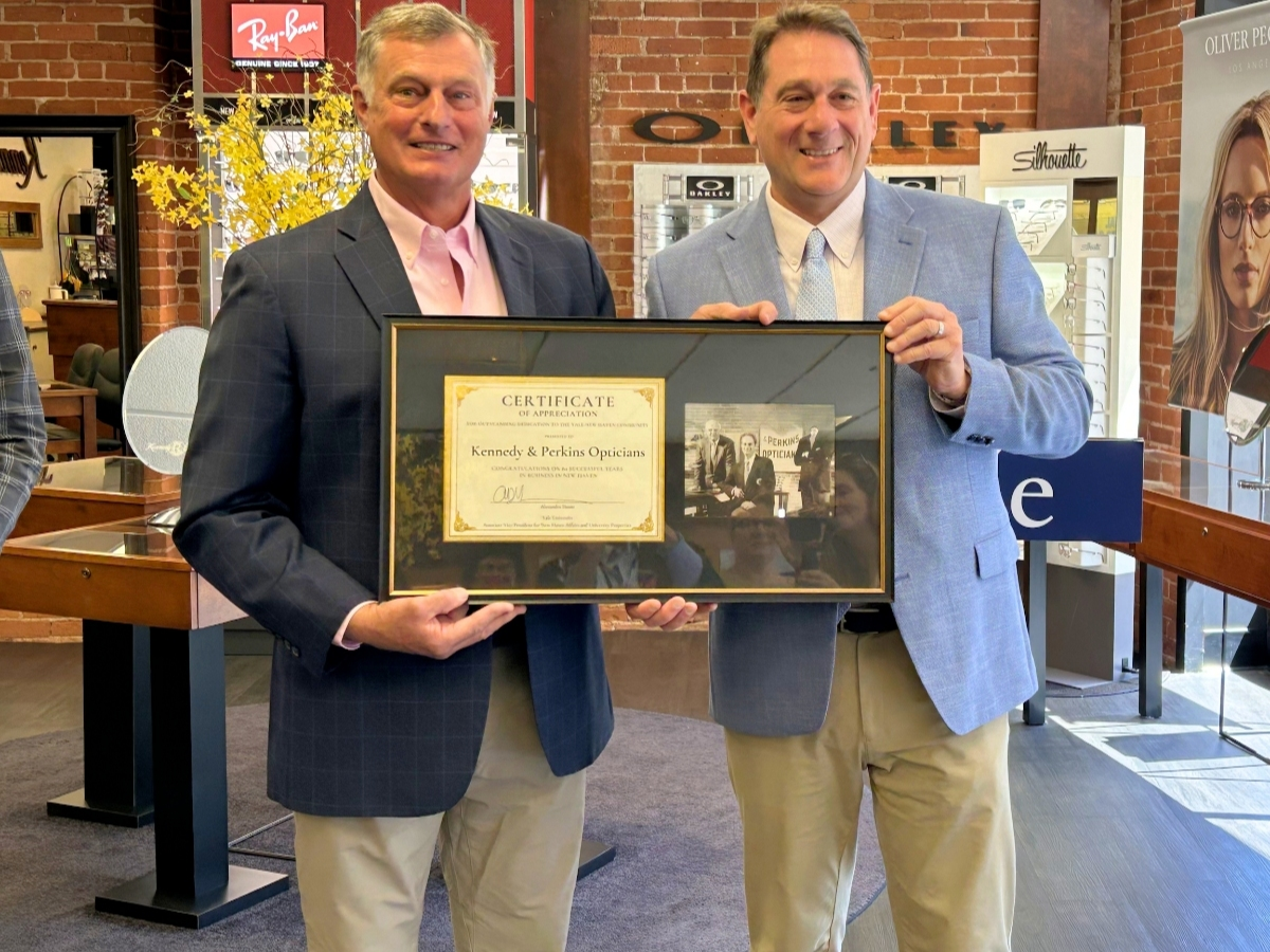 Kennedy & Perkins Opticians owner Richard Kennedy Jr. and David DelVecchio
Director, Real Estate Asset Management, Yale University Properties at the 80th anniversary celebration.