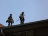 Branford firefighters on the roof of the building. 