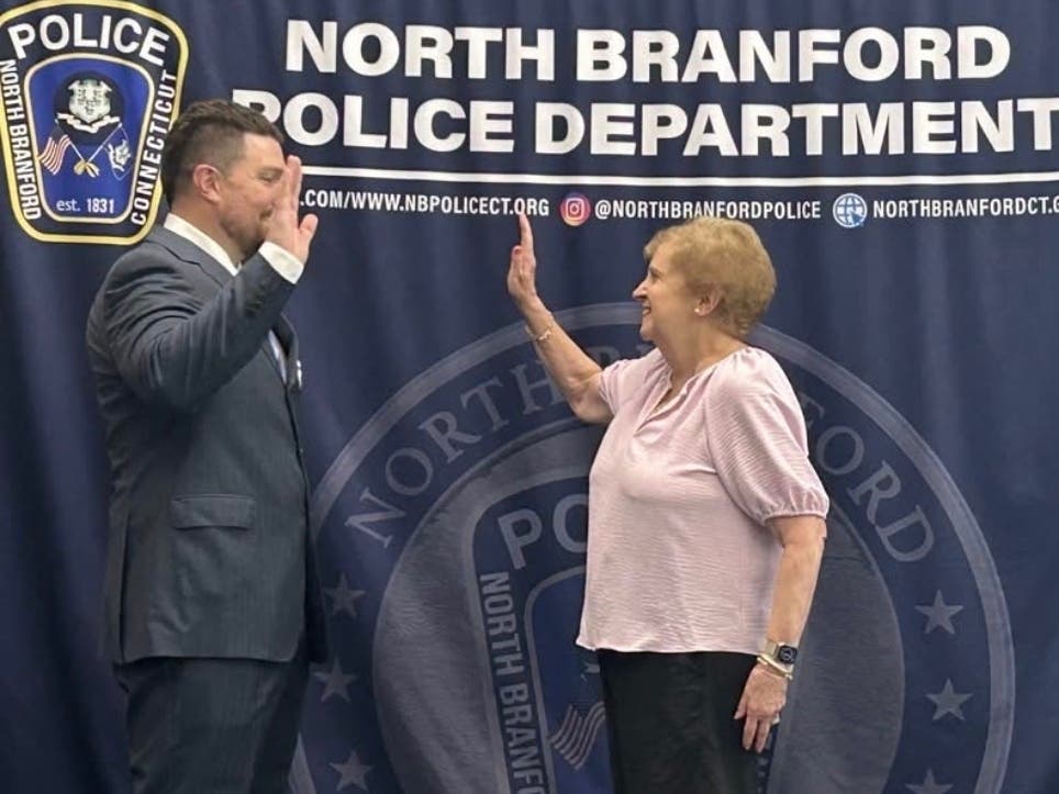 North Branford Town Councilor Marie Diamond swears-in Matthew Iannucci. 