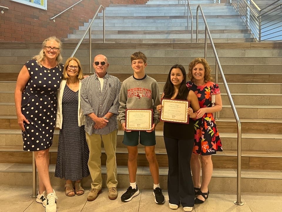 BCF Executive Director Liza Janssen Petra, Charlie's parents Sue and Bob Fiskio, scholarship recipients Logan Heath and Sofia Vallejo Contrares, and Walsh Intermediate School Principal Raeanne Reynolds.