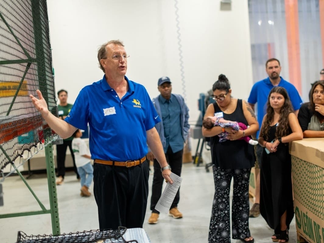 Ed McKechnie, General Manager of Leon de Oro USA, whose clients include Tennessee Titans, leads a tour of the newly expanded facility.