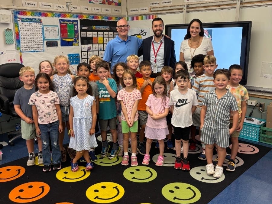 Tiskio Principal James O'Connor, Branford Public Schools Chief Operating Officer Blaize Levitan, and teacher Christine Bonatti and her first-grade class.