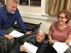 Pat Lyons, Director and Elise May, Producer rehearsing with Frank Dispigno (center)