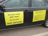 Signs on Dr. Lester Hartman's car make his stance on vaping clear.