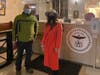 Clintonville business owners, Eric Brembeck, of Studio 35 Cinema and Drafthouse and April Rhodes, of Little Light Collective, deliver signed petitions to Columbus City Hall