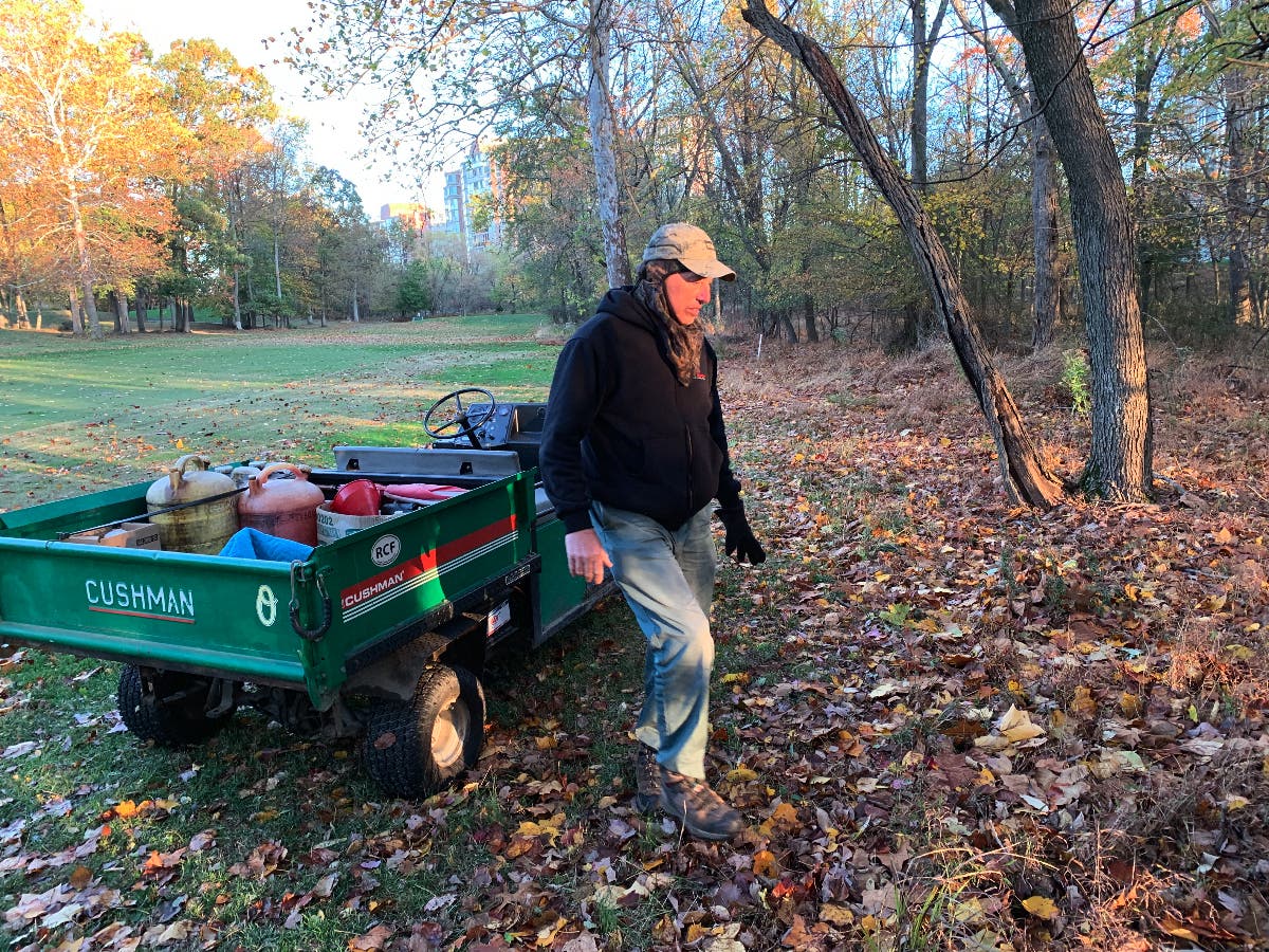 Leisure World employee John Steven Bassett retrieving his loaded crossbow