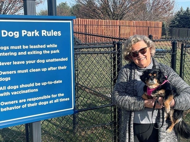 Naureen Schnee, a member of the Well-Being Committee at Ann's Choice, enjoys long walks around campus with her furry companion, Bella.