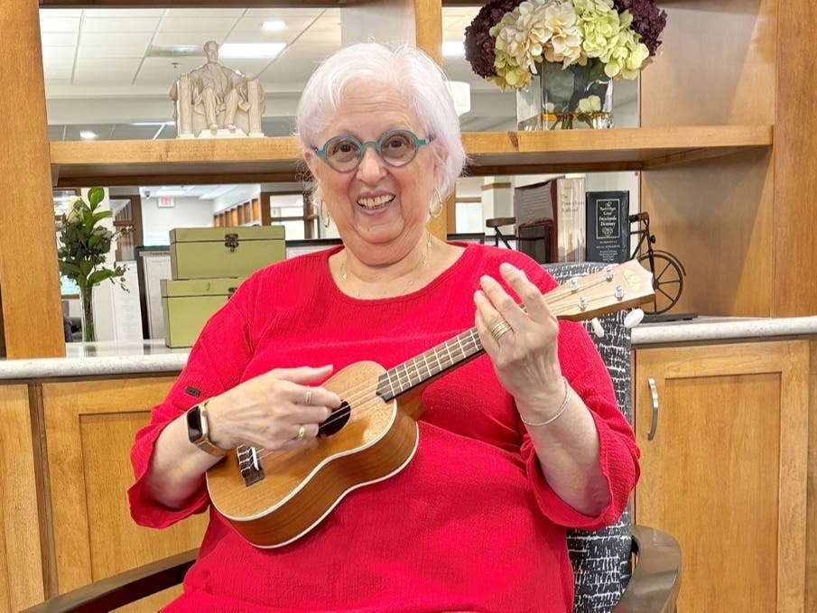 Thanks to her newfound free time, Sandy Bernstein has been able to achieve her retirement goals, including learning how to play the ukulele. Now, she leads a ukulele group!