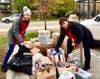Two VC Board members Susan Moller and Laura Roche help sort donations for the nonprofits