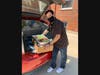 Jeff Isola, Development Director for Lydia Home accepts food donation
