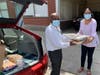 Food delivery to New Life Interim Housing Director Kelvin Johnson and Minerva Sosa, Residence Coordinator