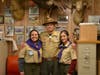 Scouts BSA Troop 4414 Scouts Amy Nova Alarcon (left) and Emily Whelchez pose with Merit Badge Counselor Paul Decker after earning the Shotgun Merit Badge