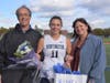 Brooke Biernacki with her parents on Huntington field hockey Senior Day.