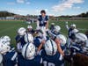 Jon Koumas gets the Blue Devils ready for the game. (Darin Reed photo.)